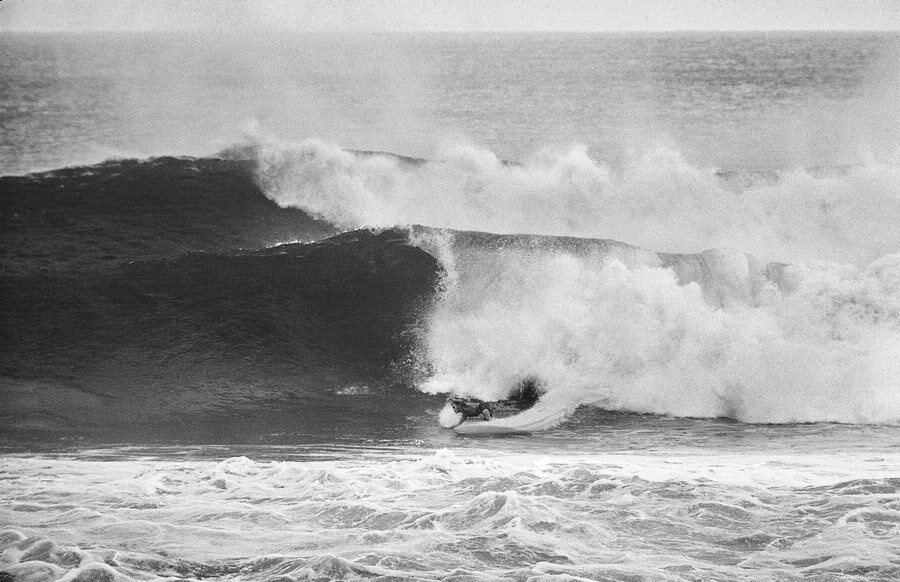 Black and white surfing wave
