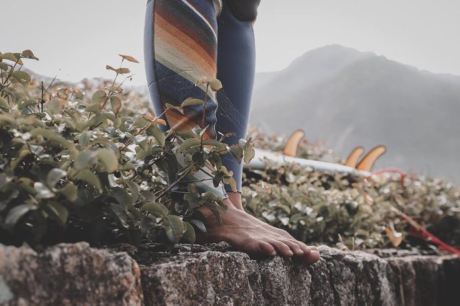 Surfer’s feet (wetsuit)