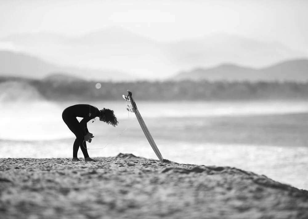 Female surfer on beach