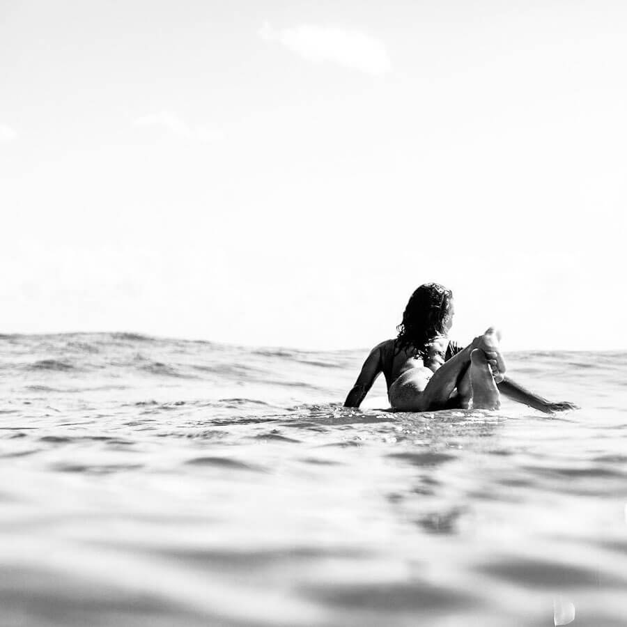 Victoria Vergara (female surfer paddling out)