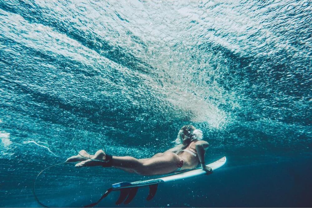Surfer, Elle Sampiere duck diving a wave