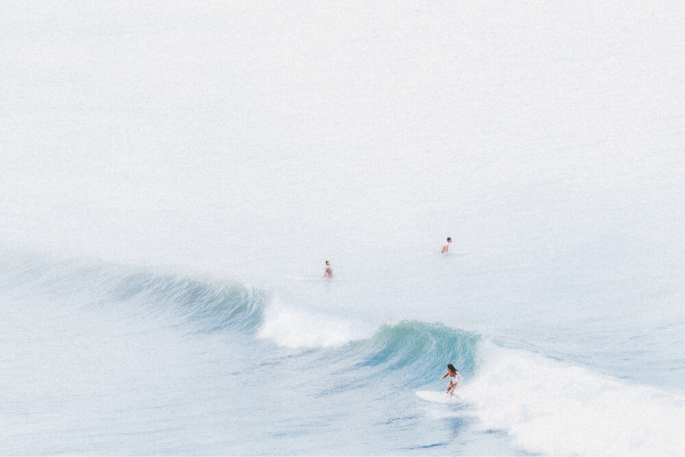 Female surfer surfing in Hawaii