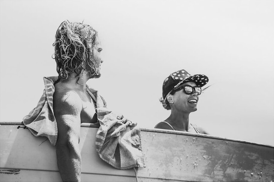 Male and female surfer