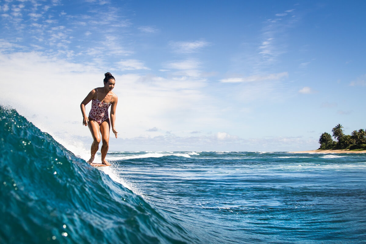 Rosie Jaffurs surfing in Hawaii. Photo by Christa Funk