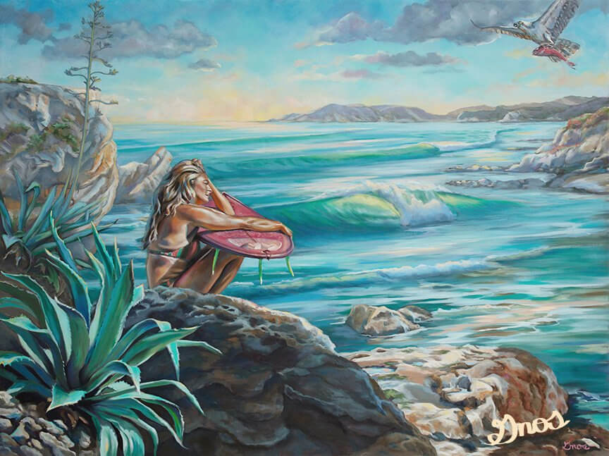 Female surfer sat in front of a surf break