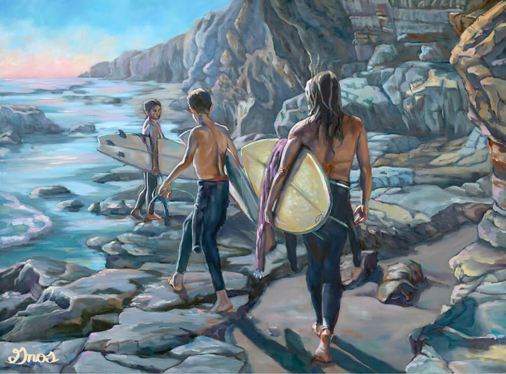 Three surfers walking out to the waves