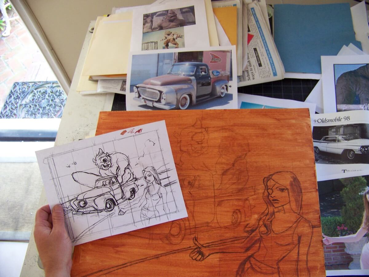 Artist transferring sketch to canvas to prepare for a painting