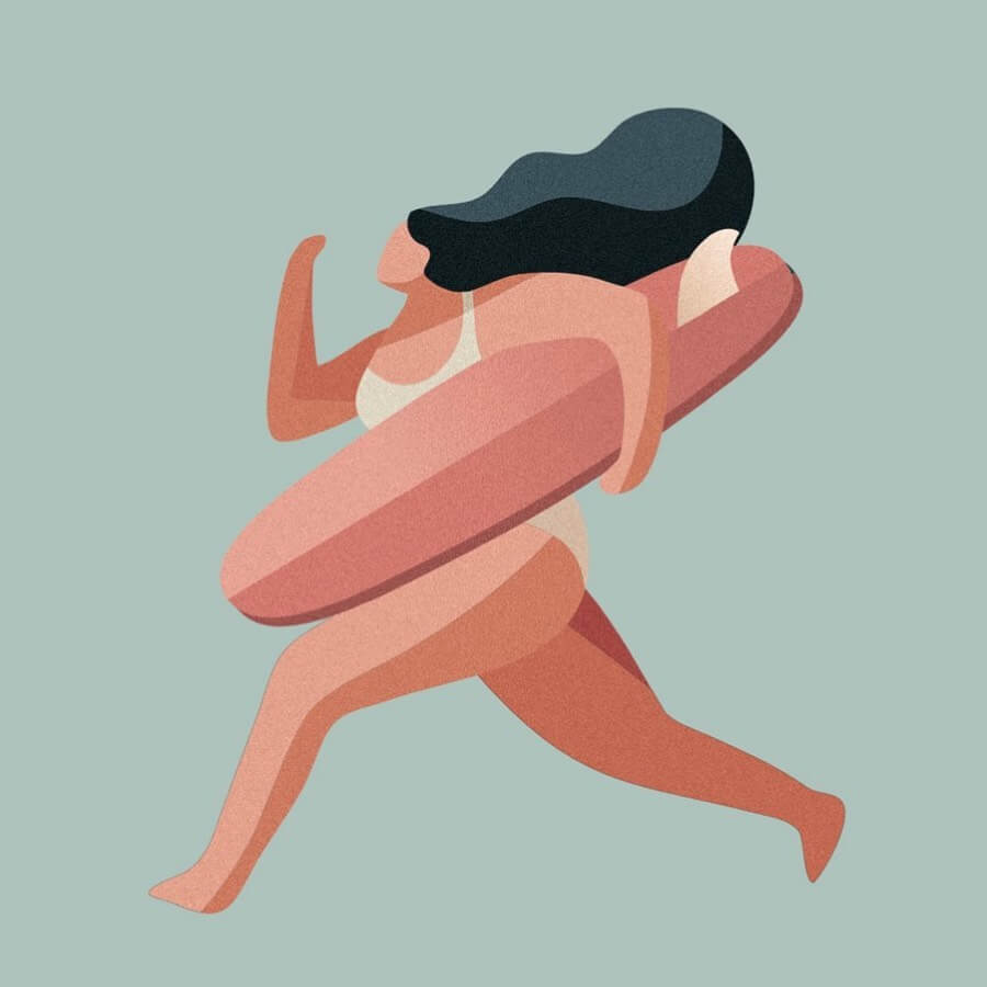 Surfer girl running to the ocean