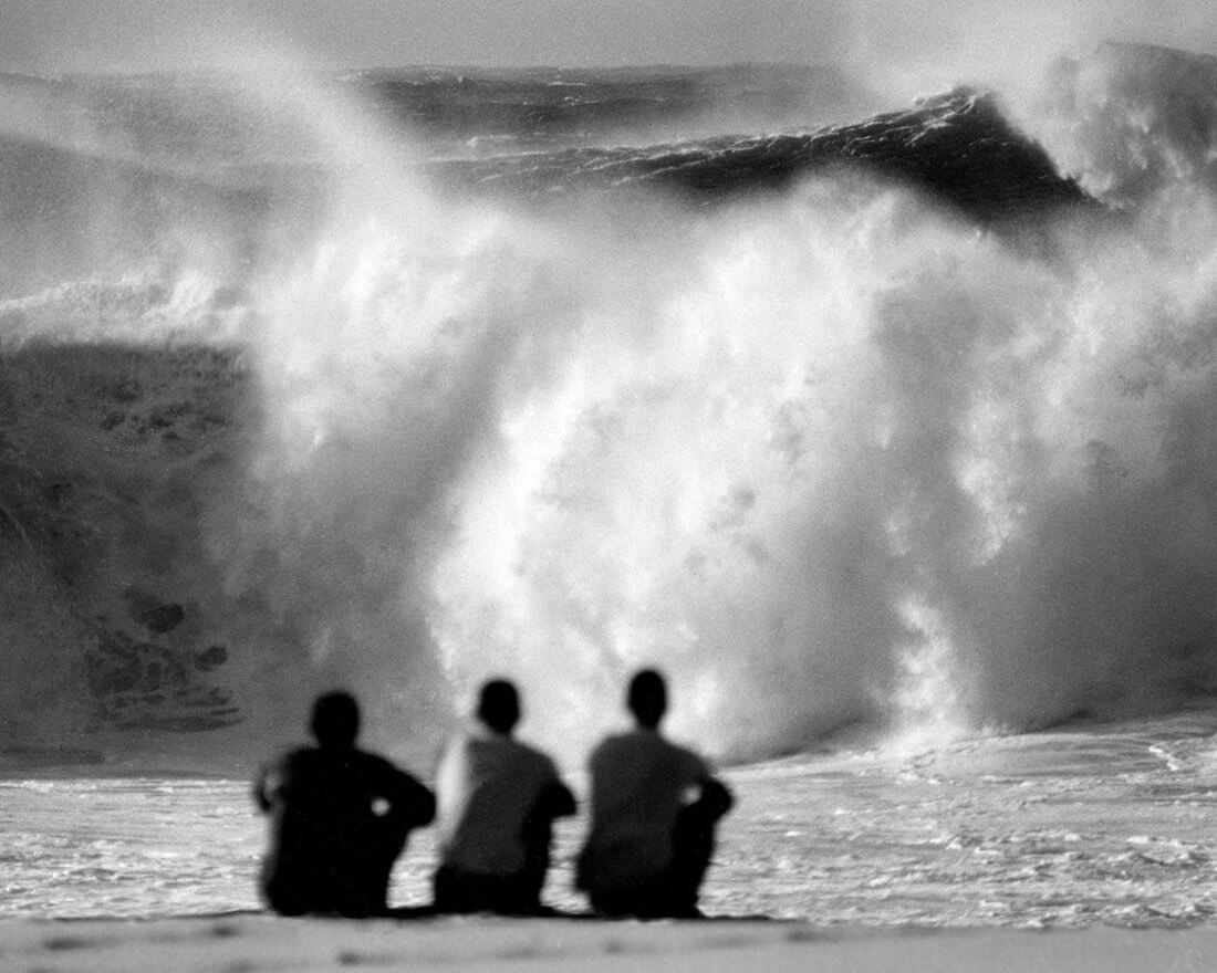 Surfers watching the Pipeline wave in Hawaii in 1959. Photo by John Severson