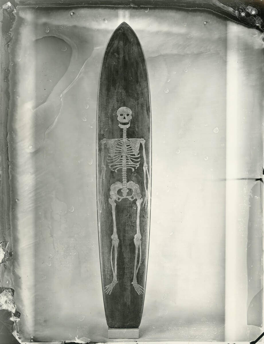 Joe Quigg shaped surfboard featuring a skeleton print. Photo by Joni Sternbach