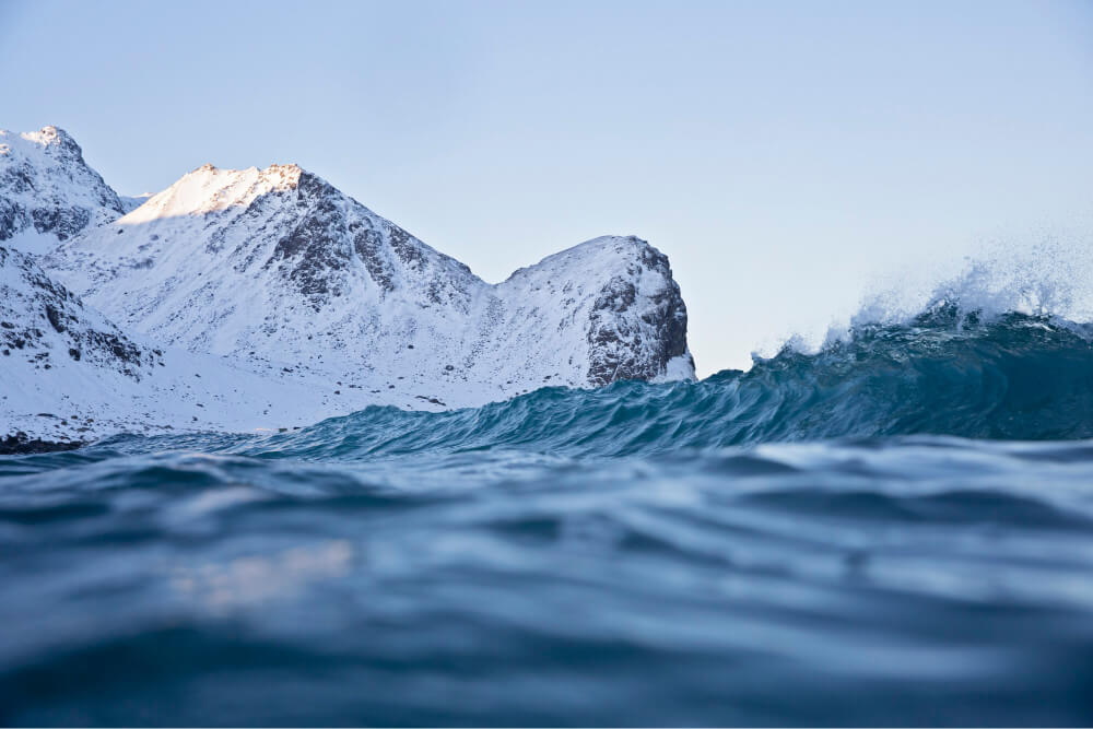 Wave breaking in a cold snowy landscape