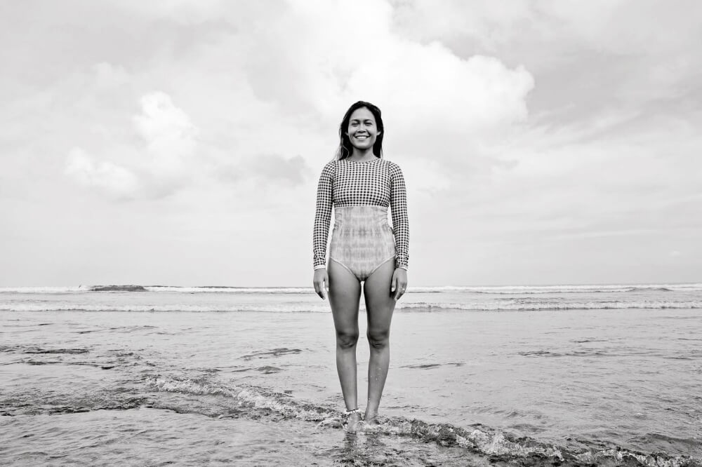 Portrait of female surfer on the beach