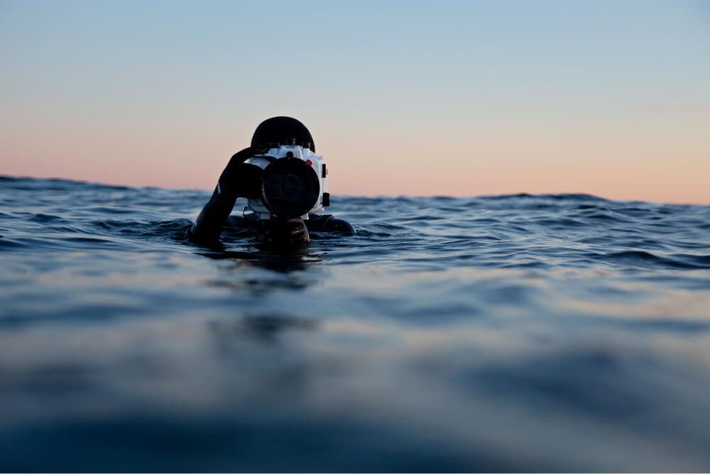 Surf photographer in the water