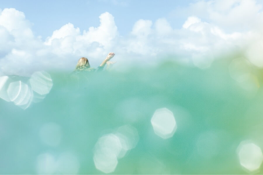 Abstract view of a surfer through a wave