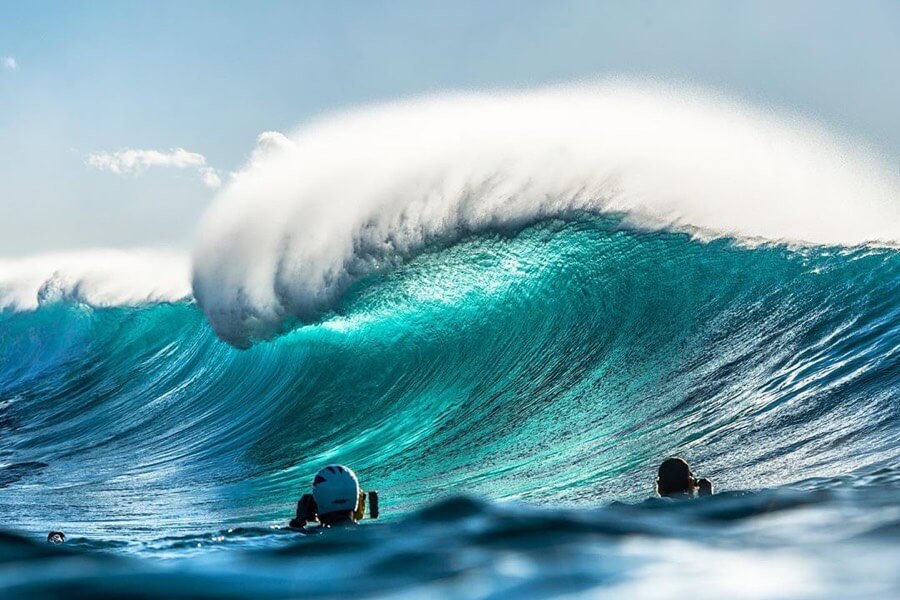 Surf photographers shooting a big wave