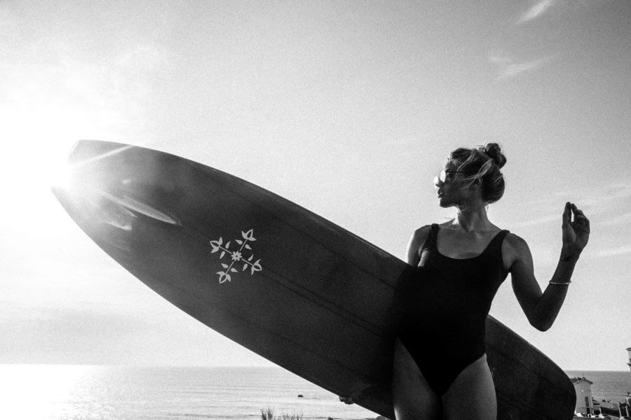 Female surfer with surfboard