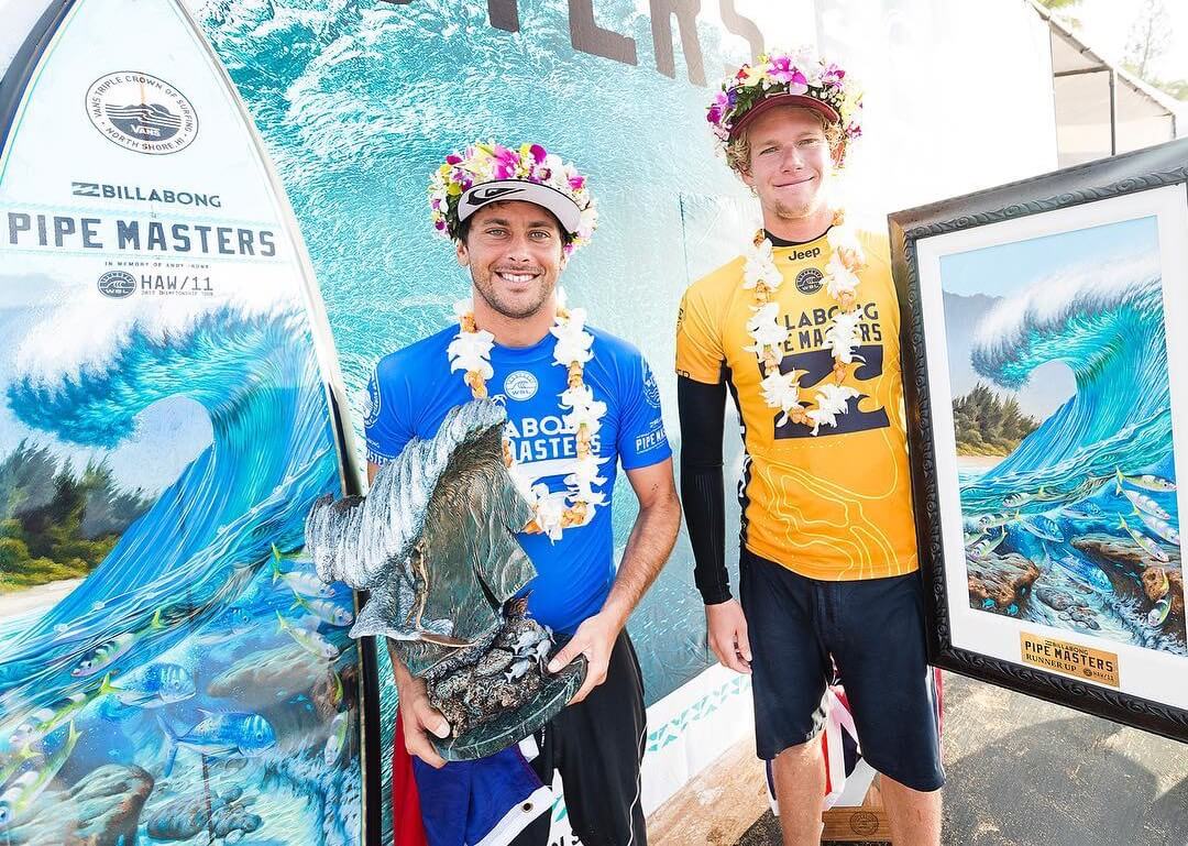 2017 Pipe Masters winner, Jeremy Flores with John John Florence and the Pipe Masters trophies and art by Phil Roberts