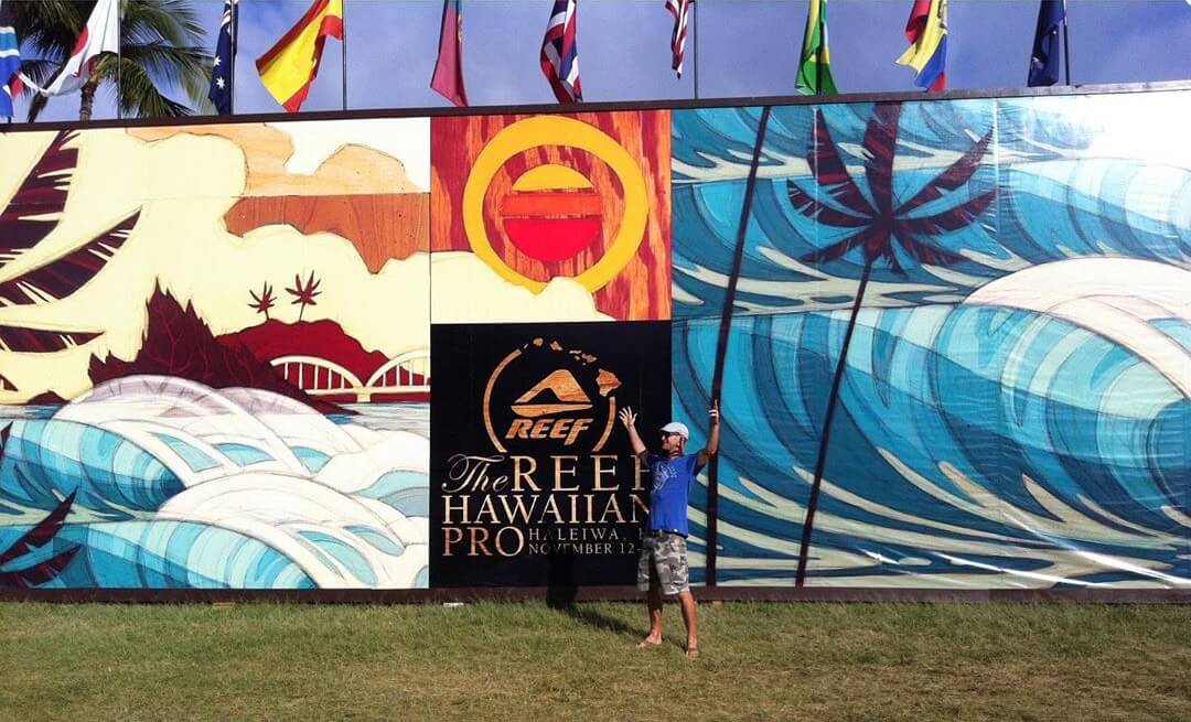 Erik Abel in front of his artwork for the Reef Hawaiian Pro 2011 surf event